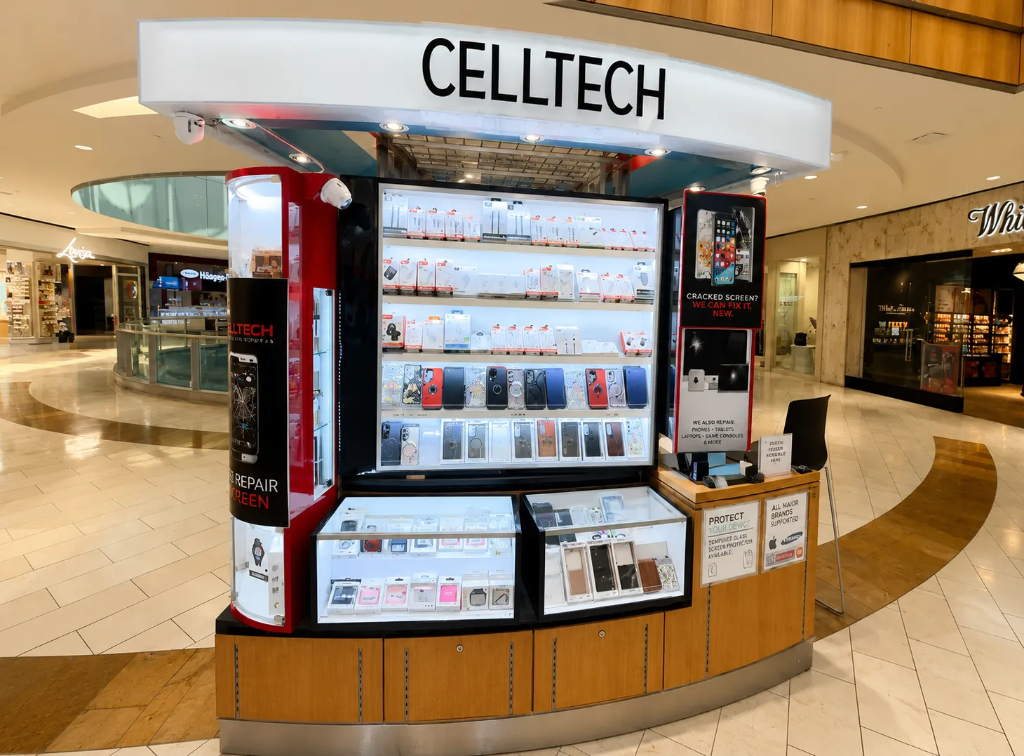 The CELLTECH kiosk on the concourse at Galleria Dallas, cases and accessories on its lit shelves