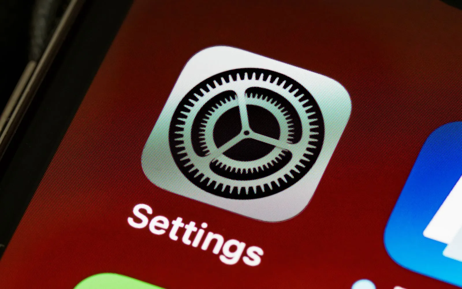 The Settings app icon on an iPhone home screen