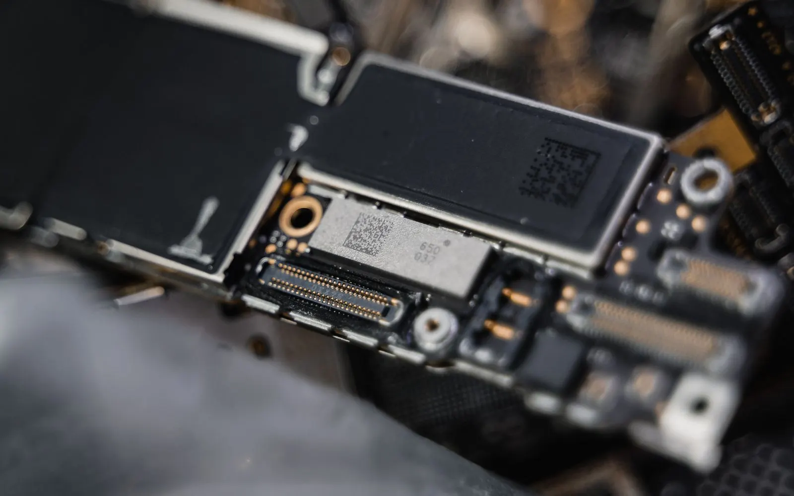 Close-up of the connectors and chips on a smartphone logic board