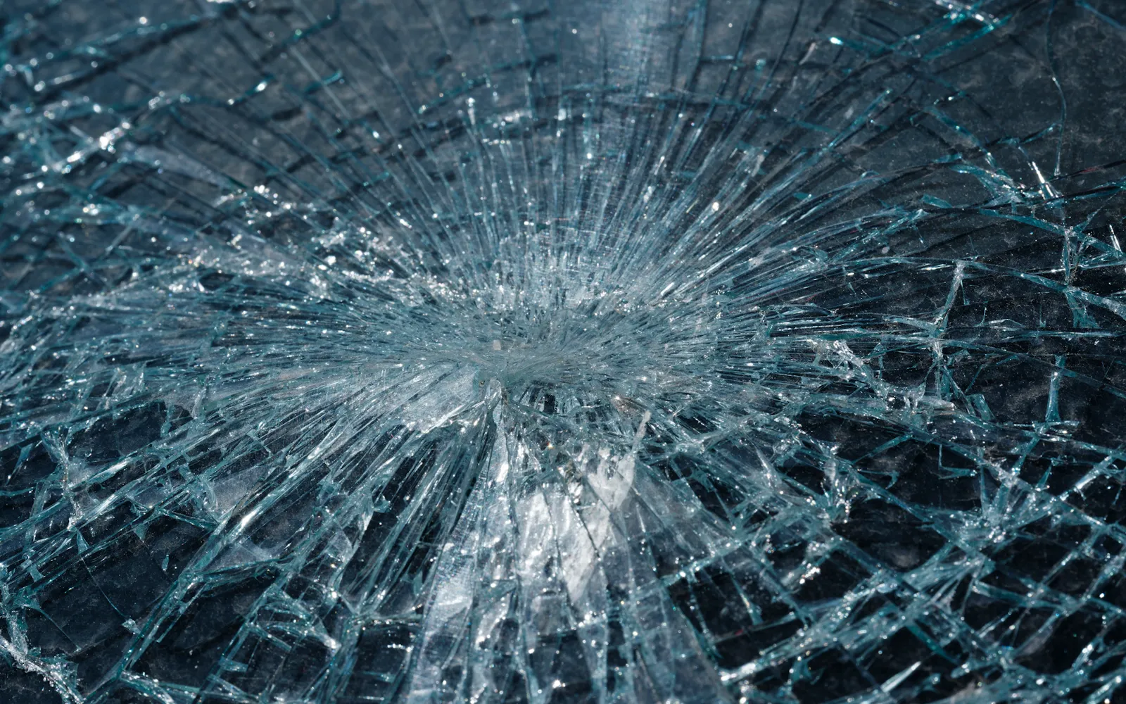Shattered glass radiating out from a single impact point